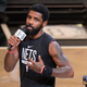 Brooklyn Nets’ Kyrie Irving speaks before the team’s NBA basketball game against the New Orleans Pelicans on Oct. 19, 2022, in New York. The Nets are suspending Irving for at least five games without pay, saying they were dismayed by his failure to “unequivocally say he has no antisemitic beliefs.” Hours after Irving refused to issue the apology that NBA Commissioner Adam Silver sought for posting a link to an antisemitic work on his Twitter feed, the Nets said that Irving is “currently unfit to be associated with the Brooklyn Nets.”